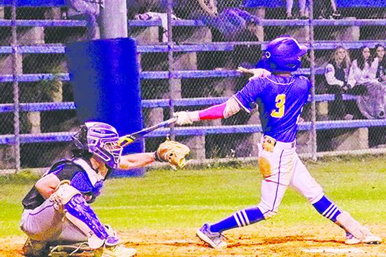 Palatka’s Tanner Ortiz delivers one of his two singles in Friday night’s Putnam County Tournament championship game at the Azalea Bowl against Interlachen. (RITA FULLERTON / Special to the Daily News)