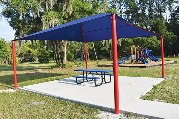 BRANDON D. OLIVER/Palatka Daily News – Jerry Bedenbaugh Community Park in East Palatka recently received a new shade for its pavilion and also got Americans with Disabilities Act-compliant parking.
