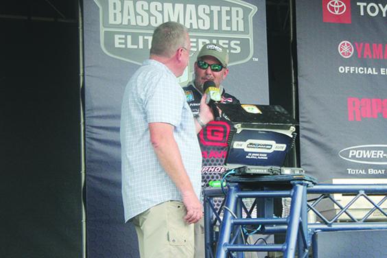 Palatka's Cliff Prince talks about his tough opening day of the tournament on stage with Thursday's emcee for the weigh-in, Chris Bowes. (MARK BLUMENTHAL / Palatka Daily News)