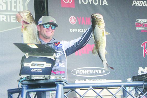 West Logan smiles showing off his catches where he caught 22 pounds even to start the four-round tournament in third place Thursday. (MARK BLUMENTHAL / Palatka Daily News)
