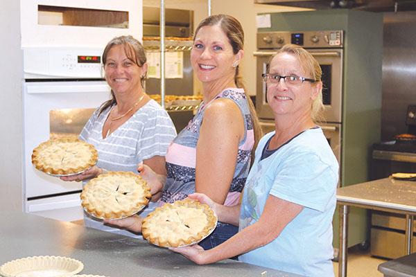 TRISHA MURPHY/Palatka Daily News – Heidi Hockenberry, left, Dawn Rawls, center, and Becky McLemore spent Tuesday at the Bostwick Community Center making pies for Saturday’s Bostwick Blueberry Festival.