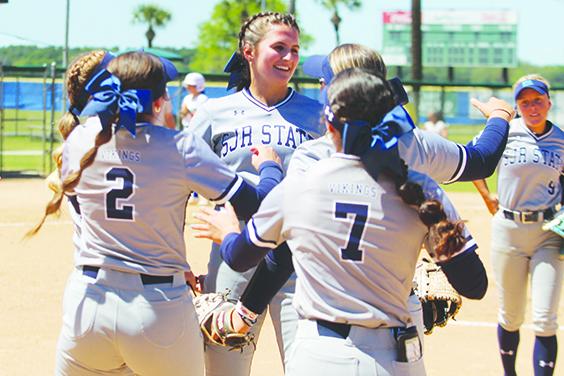 St. Johns River State College winning pitcher Brooke Strickland is greeted by teammates Jadyn Chesser (2) and Ava Ramos (7) after the Vikings clinched the Sun-Lakes Conference regular-season championship with a 10-6 game one win over Lake-Sumter State College. (MARK BLUMENTHAL / Palatka Daily News)