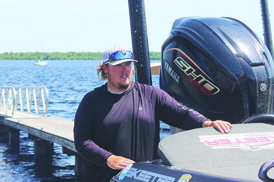 Tyler Williams of Belgrade Maine checks inventory on his boat before going out on the water for a practice round on Wednesday. The 22-year-old Williams is currently in second place in the points standings. (MARK BLUMENTHAL / Palatka Daily News)