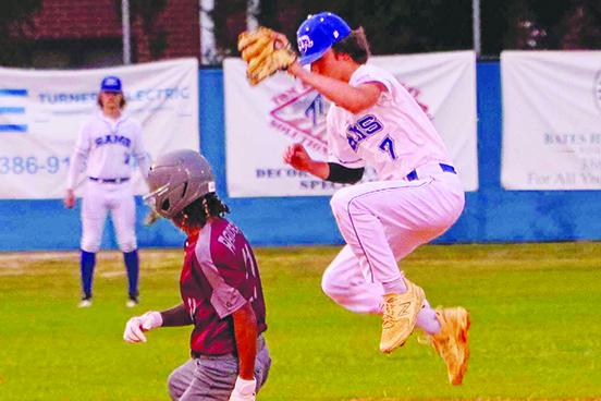 Interlachen’s Cason Thomas goes high to get a ball as Crescent City’s Brandon Padgett slides safely into second base during Monday’s Putnam County Tournament semifinals. (RITA FULLERTON / Special to the Daily News)