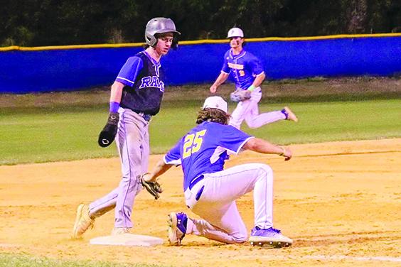Interlachen’s Cason Thomas reaches third base safely as Palatka third baseman Paxton Sweat puts the tag on him during Friday night’s Putnam County Tournament championship. (RITA FULLERTON / Special to the Daily News)
