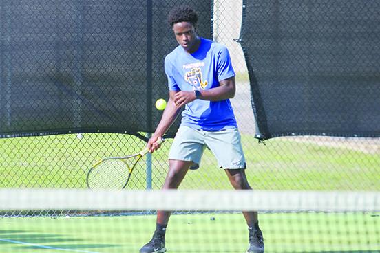 Palatka’s Trenton Williams returns the ball back during his first double match against Baker County on Tuesday. Williams and playing partner Cullen Sloan won their match, 8-4. (MARK BLUMENTHAL / Palatka Daily News)