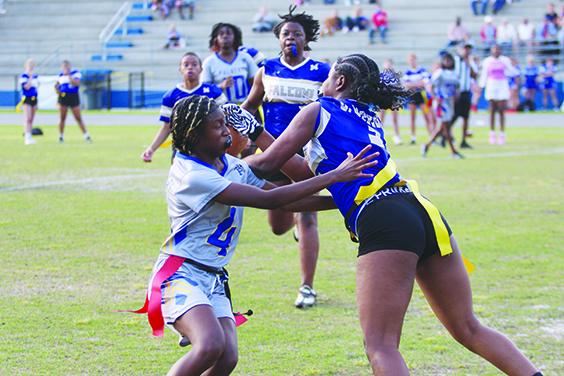 Menendez’s Dasani Newsome (right) picks off a late-game pass as Palatka’s Rashari Session (4) tries to knock the ball out of her hands in Wednesday’s District 8-1A tournament semifinal game at Clay High School. The second-seeded Falcons defeated third-seeded Palatka, 19-12, to move on to the final against Clay Friday night. (MARK BLUMENTHAL / Palatka Daily News)