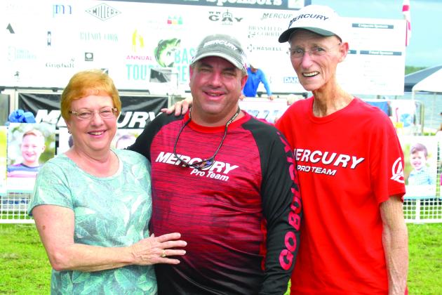 Linda Starling poses with her son, Mike Bach (center), and husband Larry Starling at the Wolfson’s Children Hospital’s Bass Tournament in 2018. (GREG WALKER / Daily News correspondent)