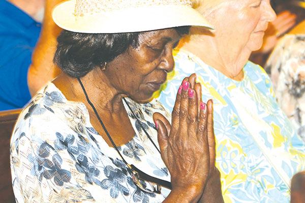 TRISHA MURPHY/Palatka Daily News – Sylvia Cooper of Palatka prays during the National Day of Prayer on Thursday in Palatka.