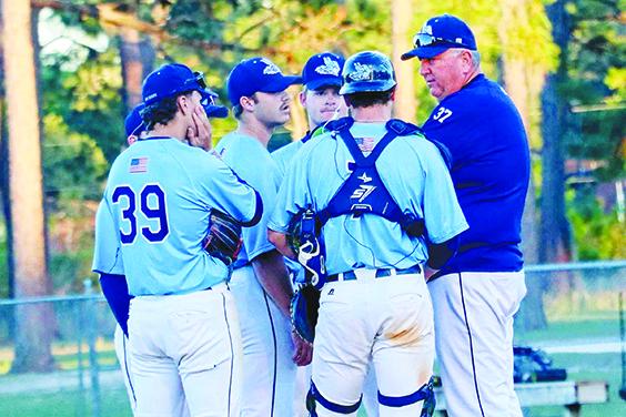 St. Johns River State College baseball coach Ross Jones talks to his team during a mound meeting in a game against Seminole State in March. (RITA FULLERTON / Special to the Daily News)