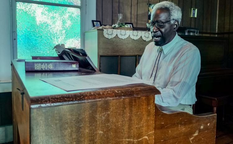 John Alexander plays the organ at St. Mary's Episcopal Church in Palatka.