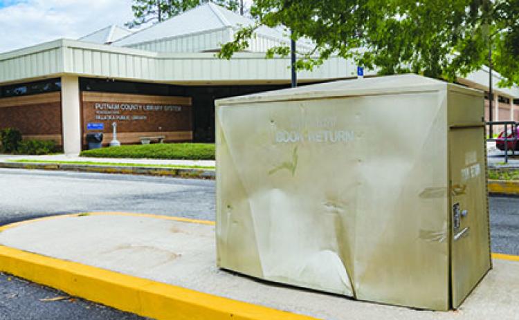 The Palatka library's book return box was damaged last month. 