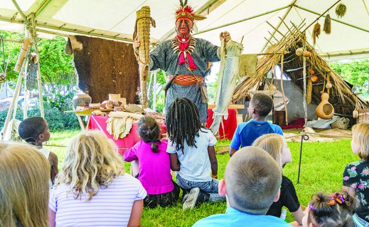 Local students learn about 18th-century artifacts and ways of life during the lead up to the Bartram Frolic.