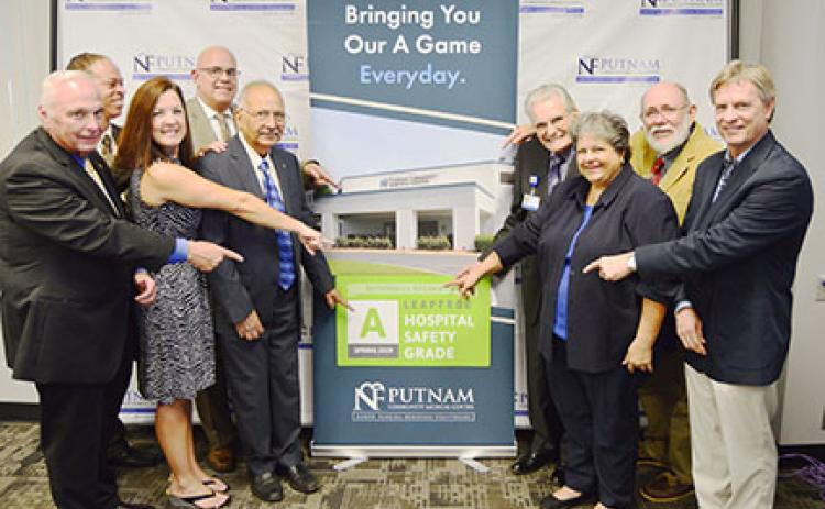 Hospital officials celebrate Putnam Community Medical Center being given safety and quality awards.