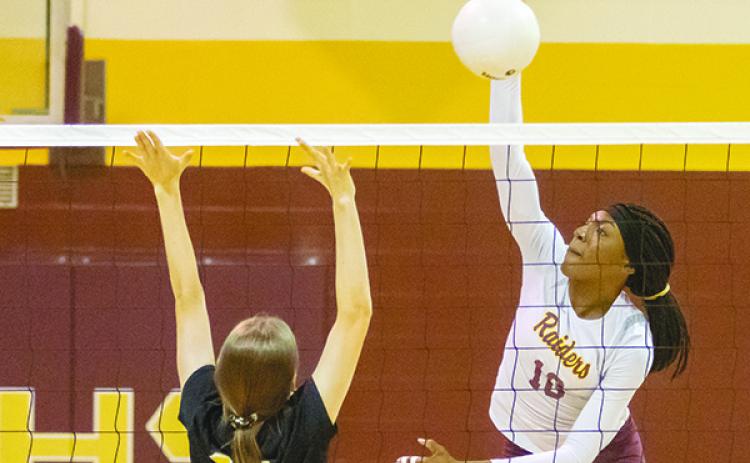 Crescent City’s Aniya Hardy, right, goes against Fort Meade’s Abby Rast during Thursday's District 8-1A volleyball final. (FRAN RUCHALSKI / Palatka Daily News)