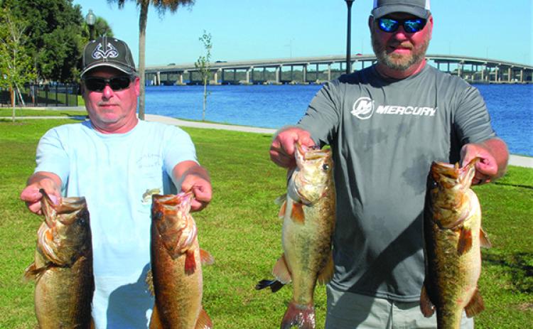 Classic winners Alan Hopper, left, and Chad Willoughby with their winning catches on Saturday. (GREG WALKER / Special To The Daily News)