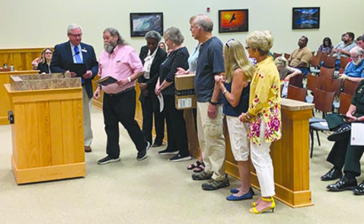 The One Book, One Putnam committee speaks to county commissioners Tuesday.