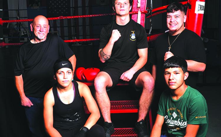 Representing Putnam County Sheriff’s Office PAL are boxers Loztris Vazquez, Ernesto Jimenez-Cruz, Coach John Brady, Robby Wells and Coach Faustino Garcia. (ALLISON WATERS-MERRITT / Special To The Daily News)