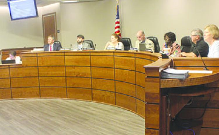 The school board discusses reorganization matters Tuesday.