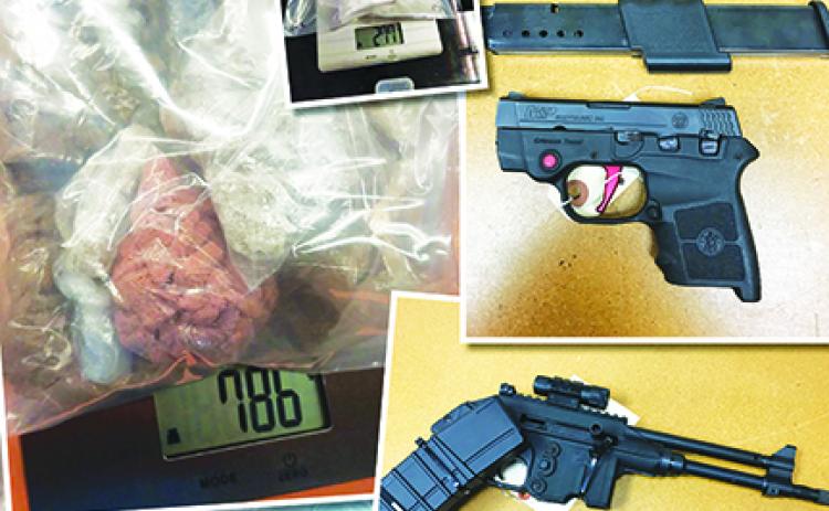 The guns and drugs collected during the FDLE operation.