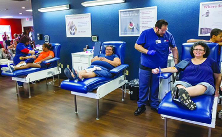 Local residents give blood at LifeSouth.