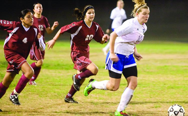 Interlachen's Jacqueline Fraga pushes the ball up the field in her final high school game in the district tournament against Jacksonville Bishop Snyder. (Daily News file photo)