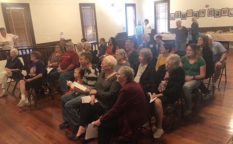 Residents attend the Arbor Day celebration at Interlachen Town Hall.
