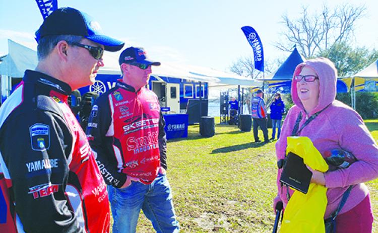 Anglers and fans talk about fishing Thursday at Riverfront Park.