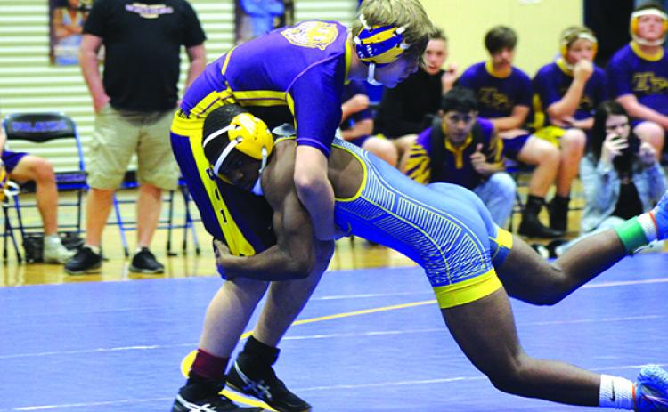 Palatka’s Delton Nealy (right) takes down Union County’s Johnny Benefield in the 145-pound class. (ANDY HALL / Palatka Daily News)
