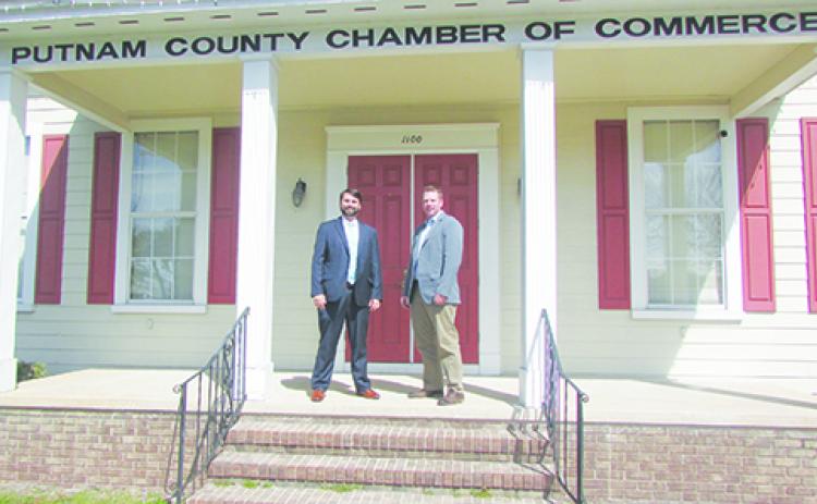 Putnam County Chamber of Commerce Chairman Charlie Douglas and Benjie Bates, the chamber’s vice chairman of emerging opportunities, stand on the steps of the chamber, which has partnered with Madison Street Strategies to promote Putnam County’s three Opportunity Zones