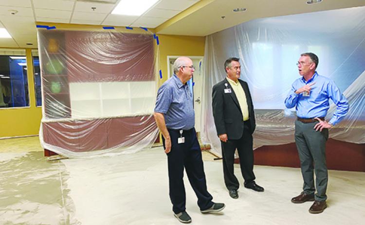 Haven Hospice officials Mark Willard, Chris Russell and Clay Dzioba discuss remaining renovations to the Roberts Care Center in Palatka, which was closed last month and is slated to reopen in March.