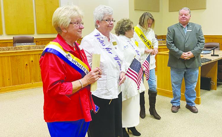 Local Woman’s Club chapter presidents and Board of County Commissioners Chairman Terry Turner celebrate the 100th anniversary of the 19th Amendment on Friday.