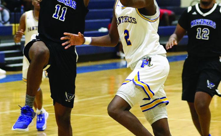 Palatka's Vanari Johnson (11) goes to the hoop on a drive against Palm Coast Matanzas earlier in the season. Even though Palatka beat Jacksonville Bolles School in the District 4-4A tournament, Bolles was given a higher seed in the Region 1-4A tournament less than a week later. (GREG OYSTER / Special To The Daily News)