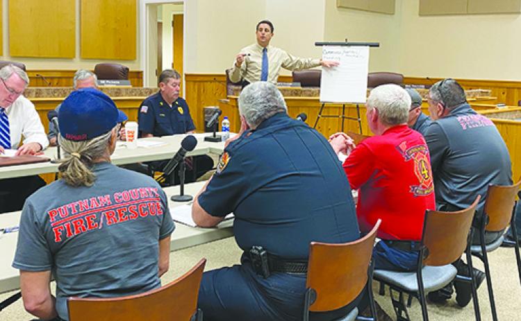 Moderator Jim Troiano reviews the needs ot Putnam County Emergency Services on Monday with the committee set up to reccomend ways to fix the problems.