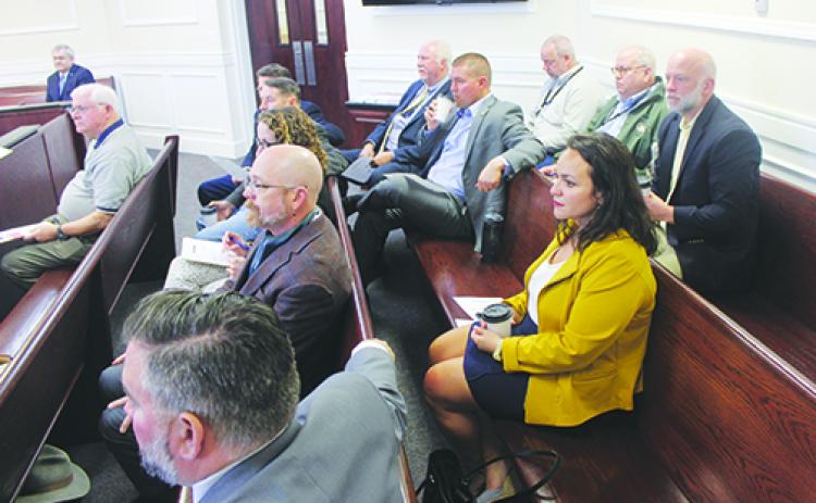 A group of local lawyers gathers in Seventh Judicial Circuit Judge Joe Boatwright’s courtroom for guidelines on participating in the Justice Teaching Program.