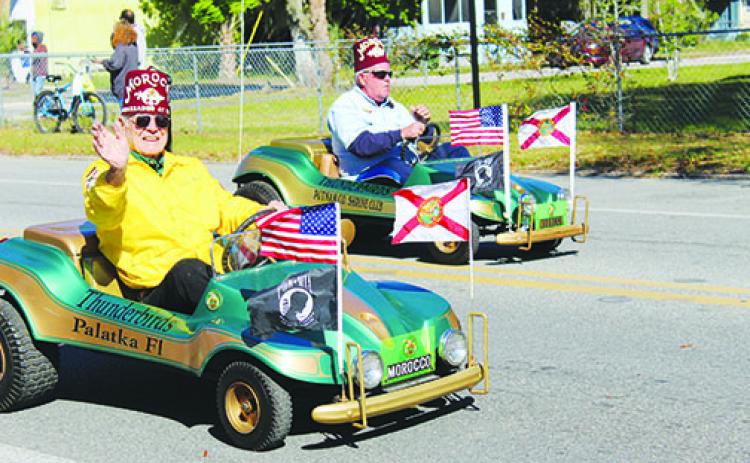 Putnam County Shrine Club members make their way along Main Street on Saturday as the Azalea Parade kicks off the 74th annual Florida Azalea Festival in Palatka.