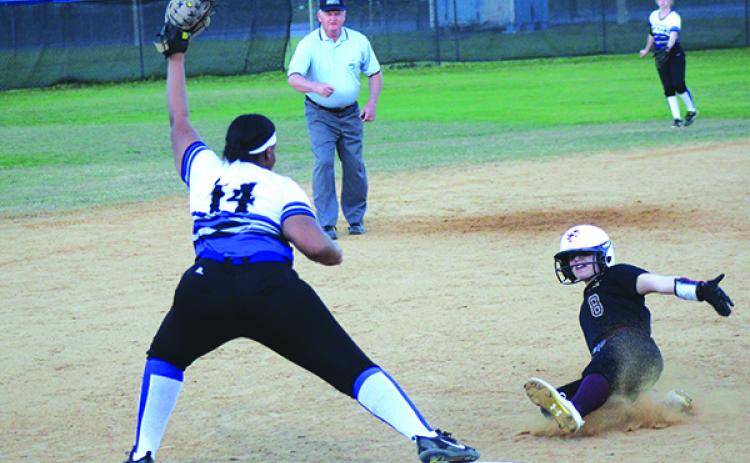 Interlachen’s Janae Green takes the throw at third from center fielder Saige Culpan, forcing St. Augustine’s Chloe Killen in the first inning. (ANDY HALL / Palatka Daily News)