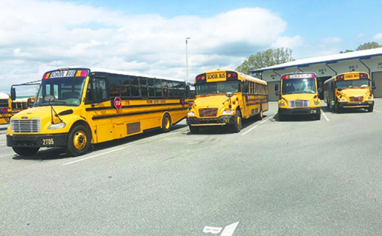 School officials said district buses would be used to deliver free breakfasts and lunches to students during their extended spring break next week.