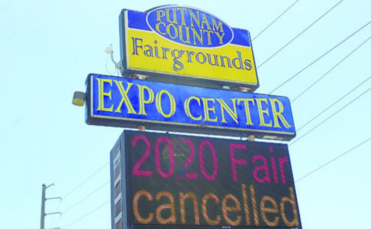 A sign in East Palatka informs passers-by the Putnam County Fair, which was supposed to begin today, has been canceled.