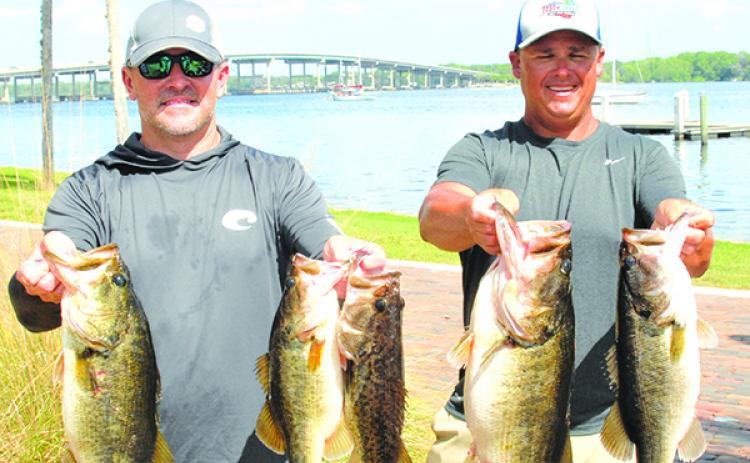 Tournament winners Jason Caldwell (left) and Lee Stalvey pose with most of its winning catch. (GREG WALKER / Special To The Daily News)