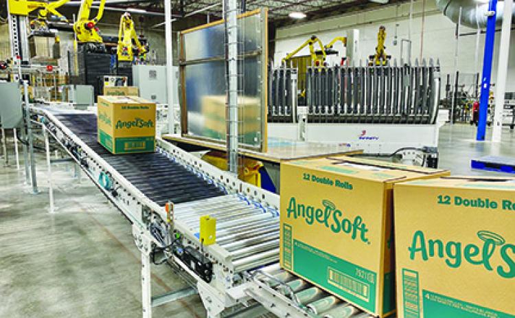 Boxes of Angel Soft bath tissue roll off the conveyor belt at GP’s mill in Palatka.