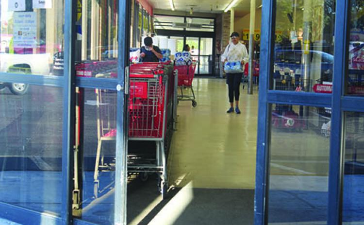 Customers shop at Save-a-Lot in Palatka on Friday morning