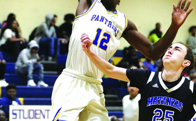 Palatka’s Wesley Roberts goes up for a shot in a win against Palm Coast Matanzas in January. (GREG OYSTER / Special To The Daily News)