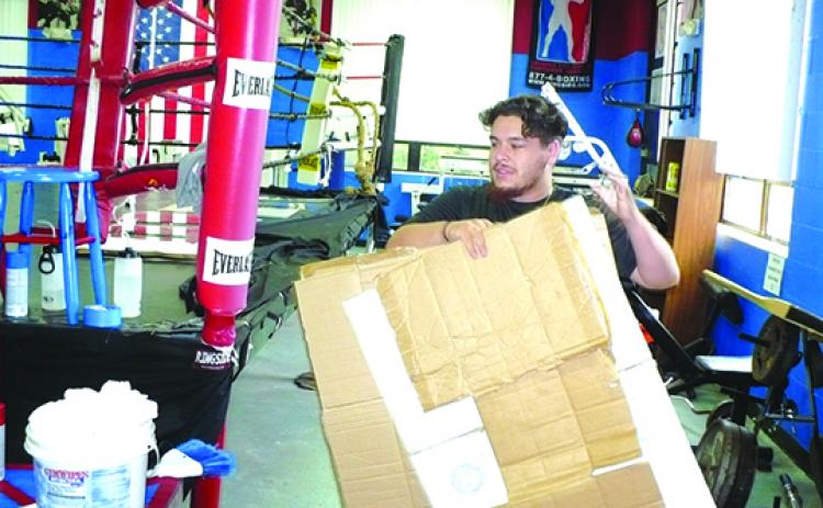 These days, Faustino Garcia, the head of the Palatka Police Athletic League boxing division, is relegated to nothing more than cleaning the East Palatka facility that houses the boxers who train there. (MARK BLUMENTHAL / Palatka Daily News)