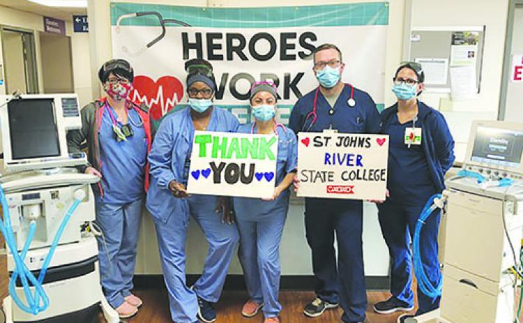 Ascension St. Vincent’s health care workers express their gratitude for the ventilator loaned from St. Johns River State College.