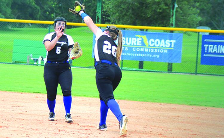 Peniel Baptist Academy softball first baseman Dylana Lynn (20) is one of numerous county high school seniors who lost their final season due to the COVID-19 pandemic. (MARK BLUMENTHAL / Palatka Daily News)