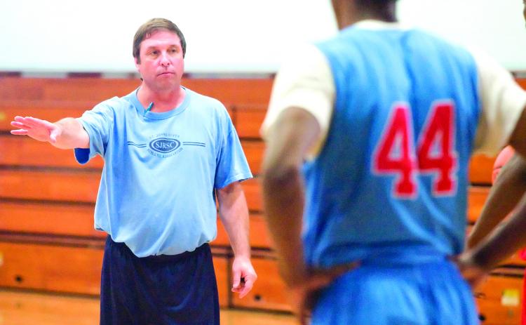 Former St. Johns River State College men’s basketball coach Buster Harvey goes over positioning during a November 2010 practice. (Daily News file photo)