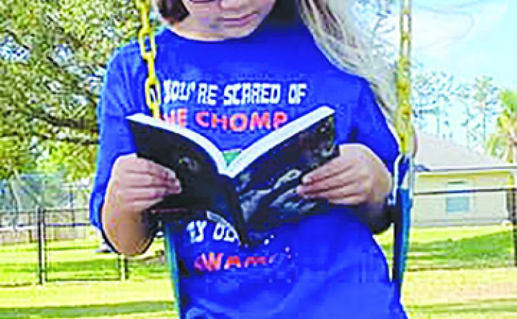 A local elementary school student participates in the Virtual Literacy Week.
