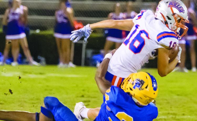 Palatka High School’s David Williams (34) wraps up Jacksonville Bolles School’s Landen Frazier (16) during a game last September. The two schools will face one another at Bolles on Sept. 25. (Daily News file photo)
