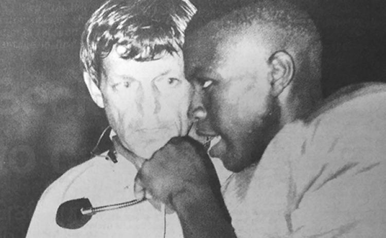 Palatka High quarterback Terrill Hill, the county’s player of the year in the 1989 season, chats with Palatka assistant coach Wilson Edwards during a game that year. (Daily News file photo)